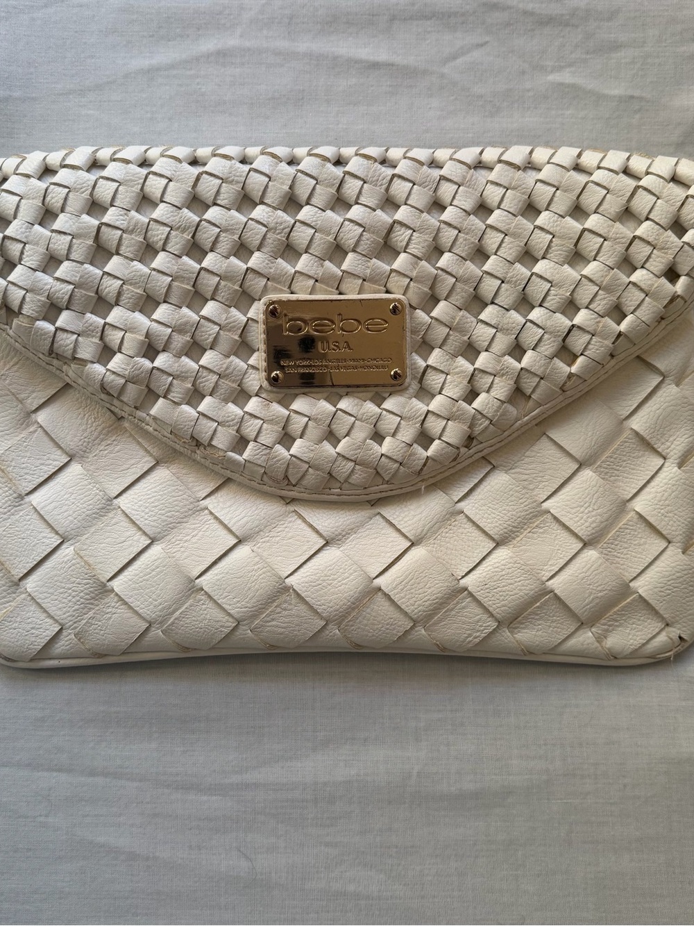 Bebe White Woven Envelope Leather Clutch with Gold Plate